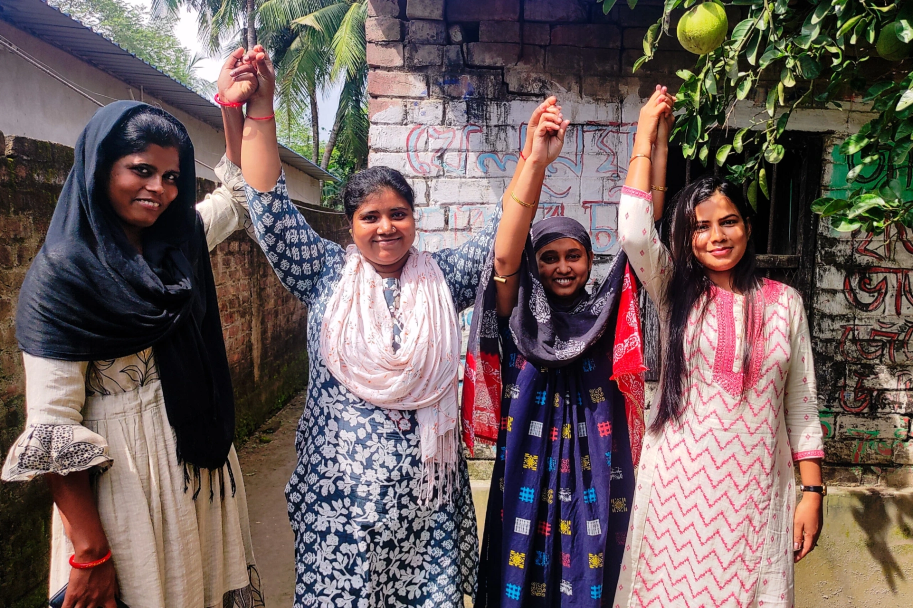 Survivors raising hands in solidarity and empowerment